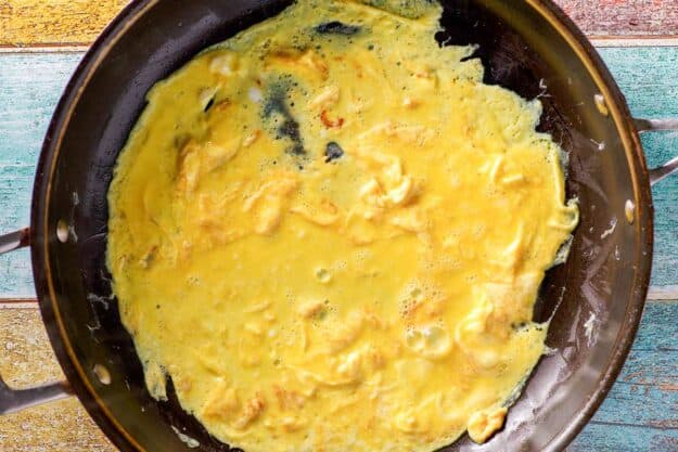 Cooking eggs and cheese for moons over my hammy sandwich.