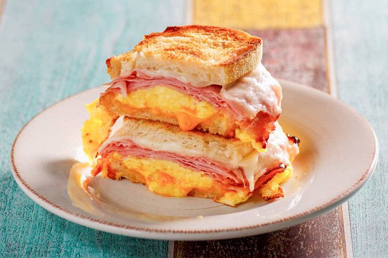 Copycat Denny's moons over my hammy sandwich cut in half on a plate.