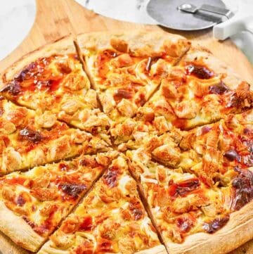 Copycat Domino's Buffalo chicken pizza on a pizza peel.