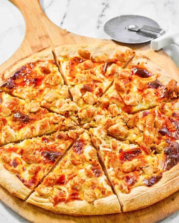 Copycat Domino's Buffalo chicken pizza on a pizza peel.