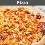 Homemade domino's buffalo chicken pizza on a wood pizza peel.