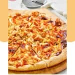 Homemade Domino's buffalo chicken pizza and a pizza cutter.