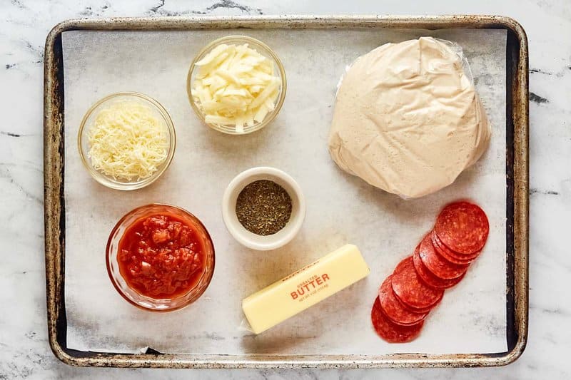 Copycat Little Caesars crazy puffs ingredients on a tray.