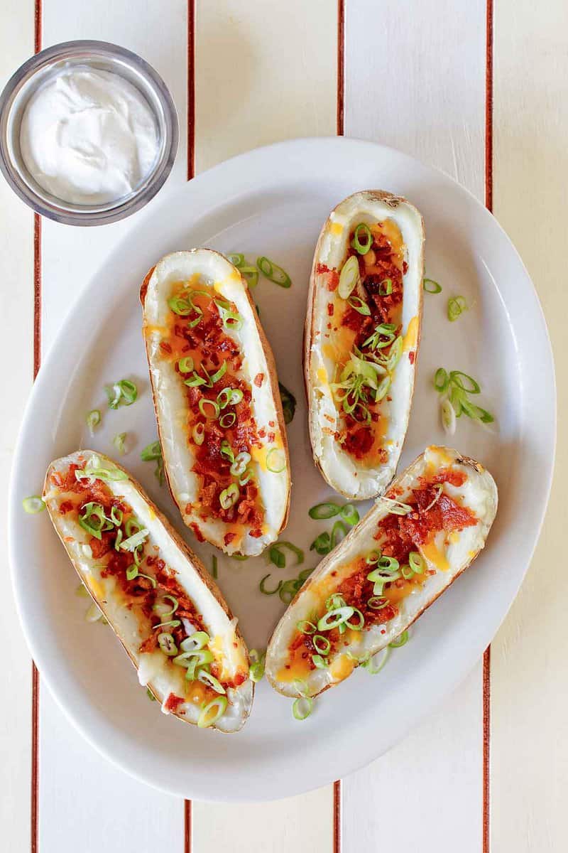 Four copycat TGI Friday's potato skins on a platter.