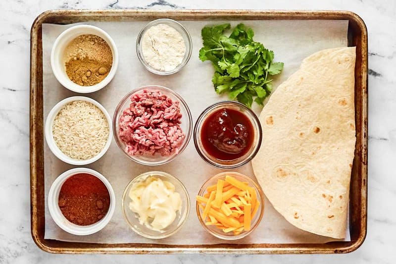 Copycat Taco Bell quesarito ingredients on a tray.