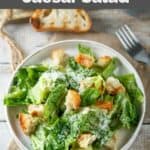 Homemade Anthony's Caesar salad, toasted bread slice, and a fork.