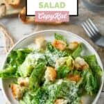Homemade Anthony's Caesar salad, a fork, and toasted bread slices.