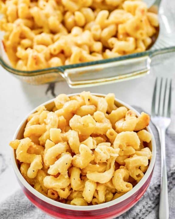 Copycat Costco mac and cheese in a bowl and baking dish.
