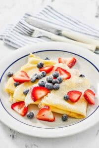 Copycat IHOP fresh berry crepes on a plate.