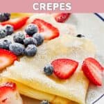 Homemade IHOP crepes topped with fresh blueberries and strawberries.