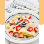 Homemade IHOP crepes topped with fresh berries.