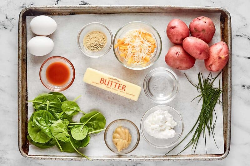 Copycat Starbucks potato cheddar chive bakes ingredients on a tray.