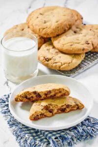 Copycat Crumble chocolate chip cookies and a glass of milk.