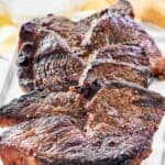 Several homemade Fogo de Chao picanha steaks on a platter.