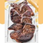 Grilled picanha steaks on a platter.