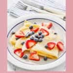 A plate of copycat IHOP fresh berry crepes.