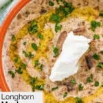 Homemade Longhorn Steakhouse mushroom bisque garnished with sour cream.