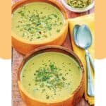 Acorn squash soup in two wood bowls.
