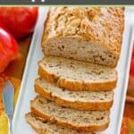 Homemade apple bread with nuts and a knife.