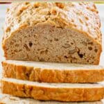 A loaf of homemade apple bread with nuts.