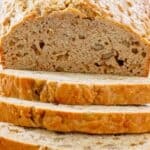 A sliced loaf of apple bread.