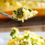 Broccoli rice casserole on a fork.