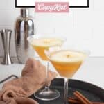 Caramel apple martinis garnished with an apple slice.