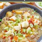 Cheeseburger soup garnished with croutons and green onions.