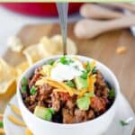 Chili and a spoon in a bowl.