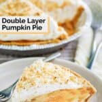 Homemade double layer pumpkin pie slice and a fork on a plate.