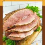 Homemade honey baked ham on a cutting board.