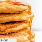 Syrup running down the side of a stack of copycat IHOP pumpkin pancakes.