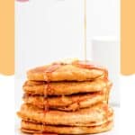 Pouring syrup over a stack of homemade IHOP pumpkin pancakes.