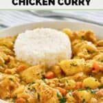 A bowl of Instant Pot Thai yellow chicken curry and white rice.