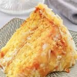 A slice of mountain dew cake with coconut pineapple icing.