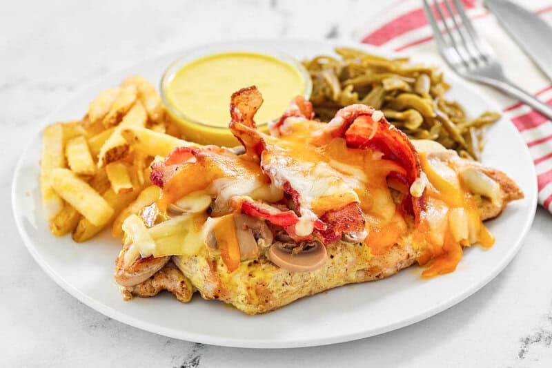 Copycat outback steakhouse alice springs chicken, honey mustard sauce, green beans, and fries.