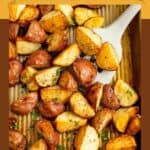 Roasted red potatoes on a baking sheet.
