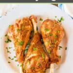 Three roasted turkey legs garnished with fresh parsely.