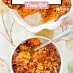 Sweet potato casserole with pecan topping and a fork in a bowl.