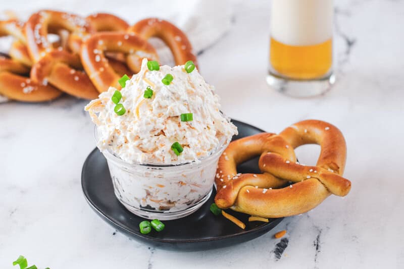 Cold beer cheese dip, soft pretzels, and a beer.