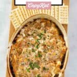 Hot boudin dip and crackers on a wood serving board.