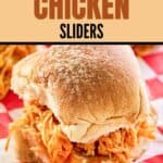 A buffalo chicken slider on parchment paper.
