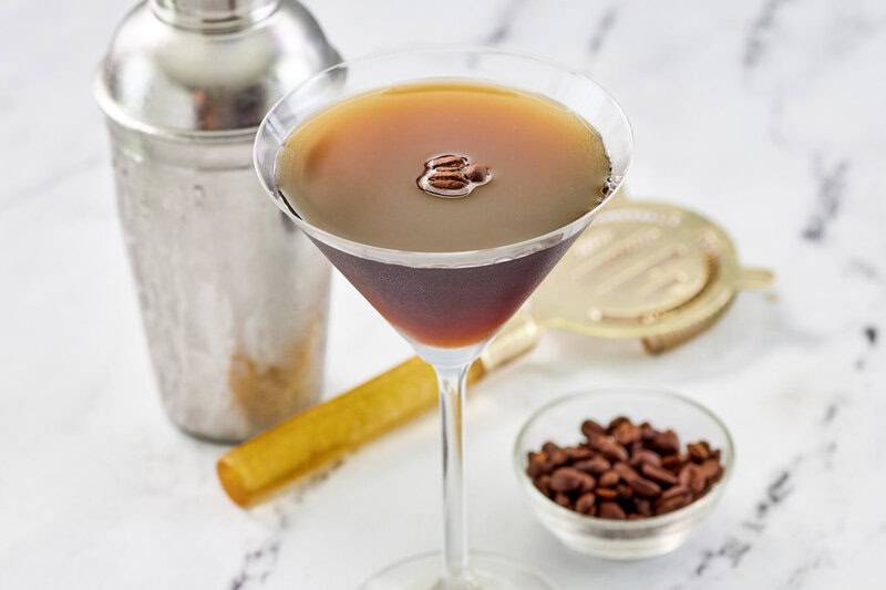 Copycat chili's espresso martini garnished with three espresso coffee beans.