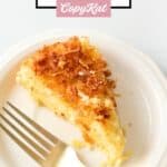 A slice of coconut custard pie and a fork on a small plate.