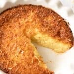 Coconut custard pie in a ceramic pie plate.