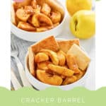 Two bowls of copycat Cracker Barrel apple cobbler and two apples.