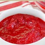Cranberry jello salad in a small bowl.