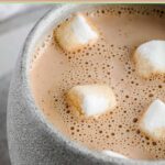 Homemade hot chocolate with four marshmallows on top.