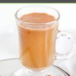 Homemade hot buttered rum drink in a glass mug.