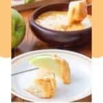 Homemade Melting Pot cheddar cheese fondue in a bowl and on dippers.